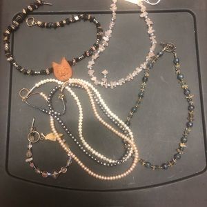 4 necklaces and a bracelet